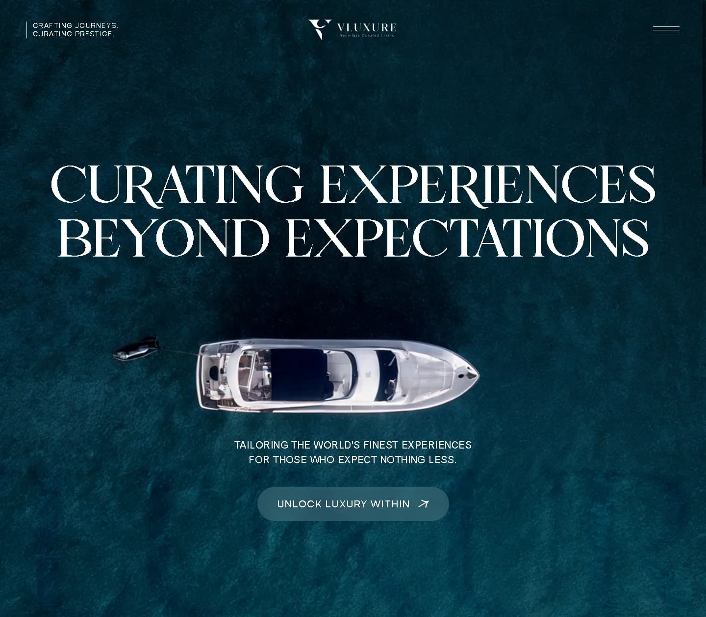 Vluxure website hero, an aerial view of a yacht on dark teal water under the words Curating experiences beyond expectations